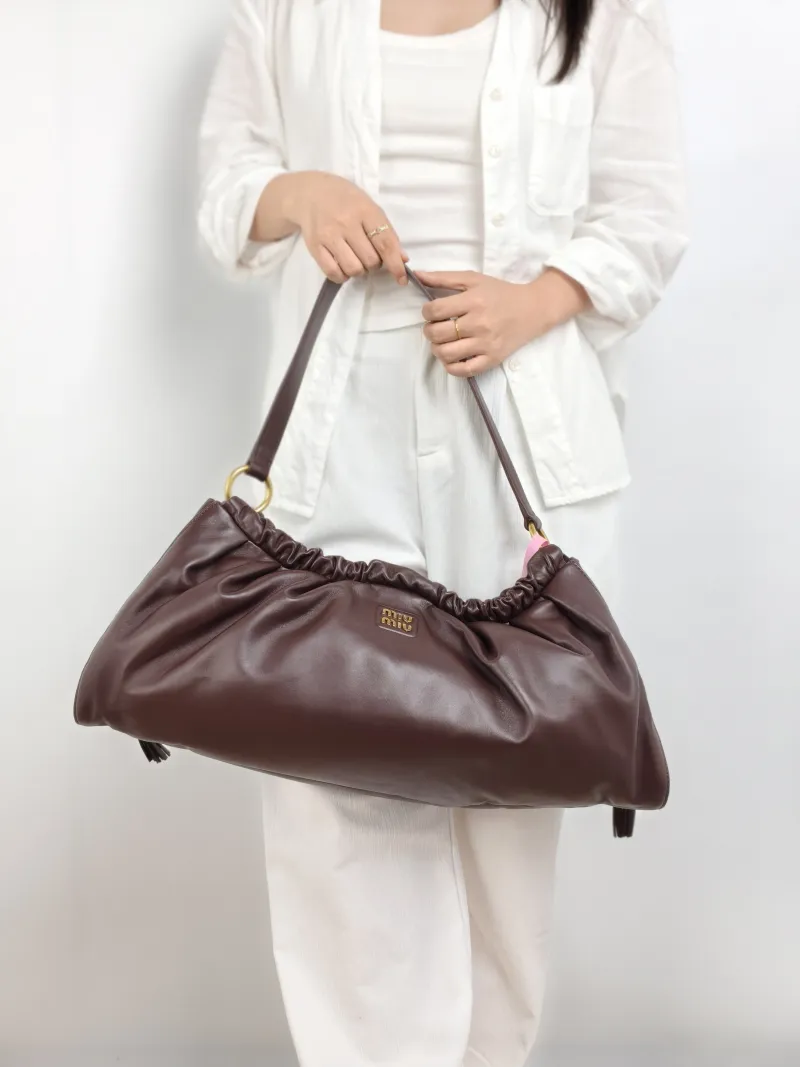 Miumiu Shoulder Bag Joie Shoulder Bag Lambskin 52 × 9 × 23 cm — on-model view 1 of 2