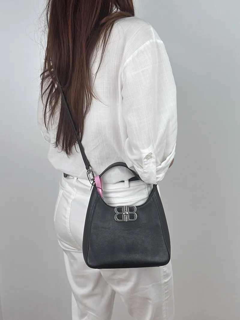 BALENCIAGA Crossbody Bag Crossbody Bag Black Calfskin 20 × 7 × 19 cm — on-model view 1 of 2