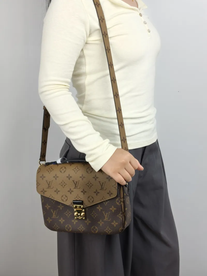Louis Vuitton Crossbody Bag Pochette Métis Monogram Colorblock PVC Medium 25 × 7 × 19 cm — on-model view 1 of 3