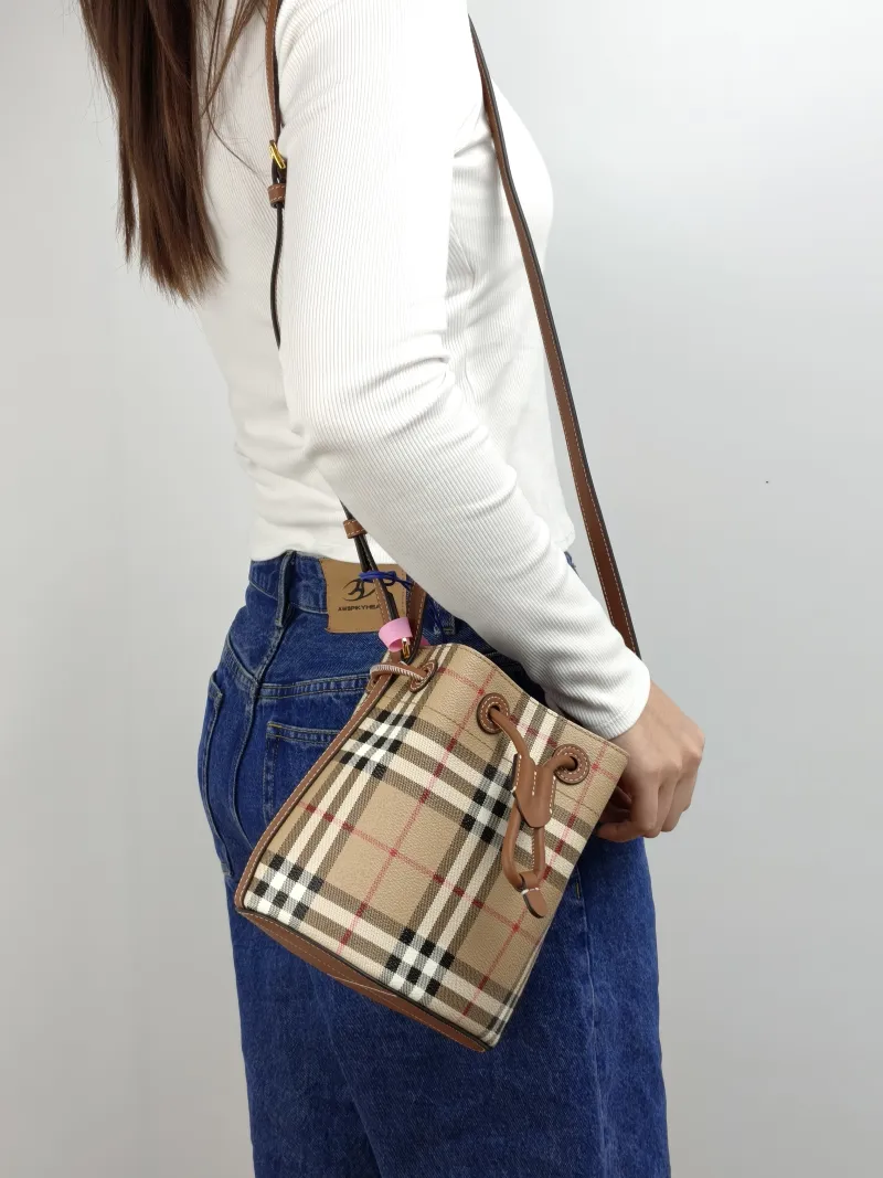 BURBERRY Crossbody Bag Canvas Bucket Bag Brown 16.5 × 11 × 18 cm — on-model view 1 of 3