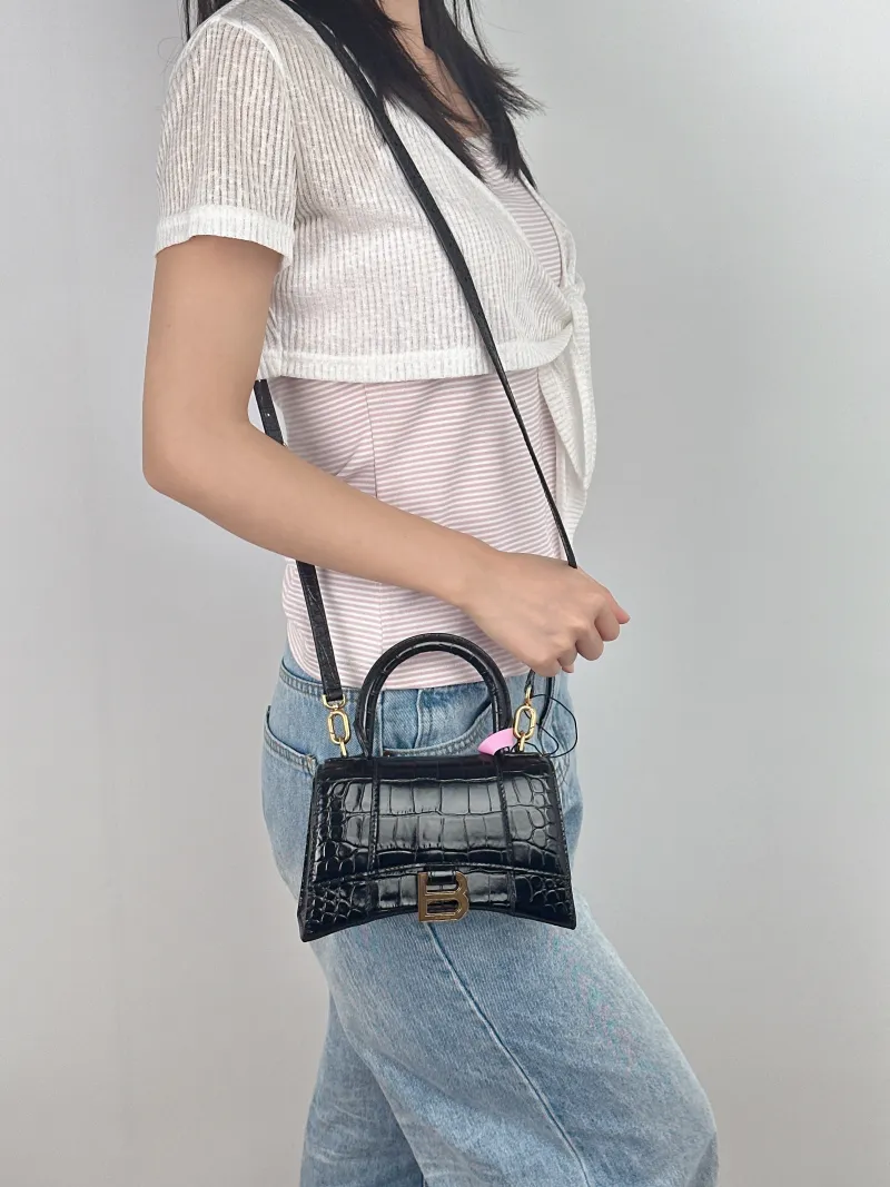 BALENCIAGA Crossbody Bag Hourglass Hourglass Bag Black CC alfskinmini19 × 8 × 13 cm — on-model view 1 of 3