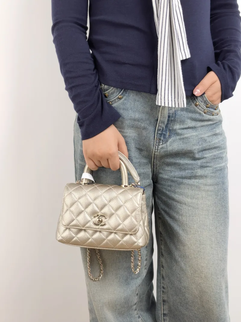 Chanel Crossbody Bag Coco Handle​ Grained Calfskin Mini 19 × 9 × 13 cm — on-model view 2 of 3