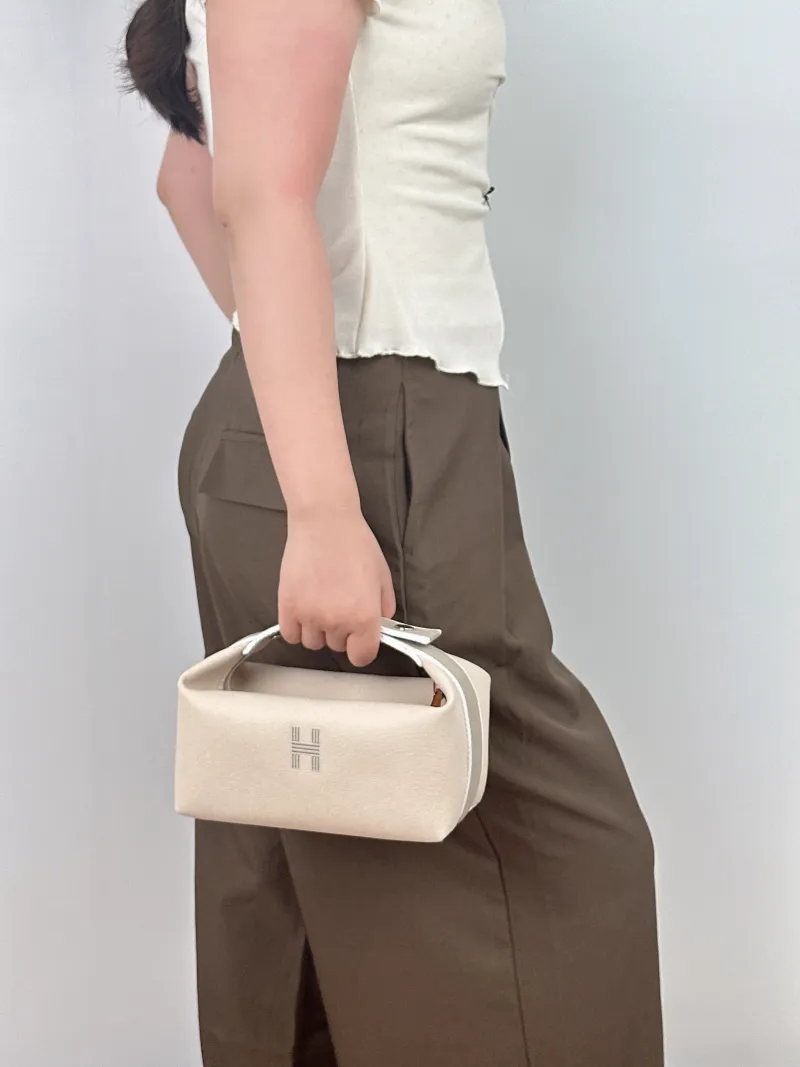 Hermès Top Handle Bagbride-a-brac White Canvas Small21 × 12 × 27 cm — on-model view 2 of 2