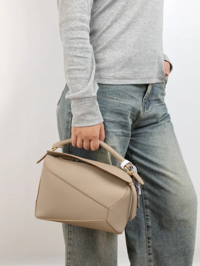 LOEWE Crossbody Bag Puzzle CC alfskin Small 24 × 10.5 × 16.5 cm — on-model view 1 of 3