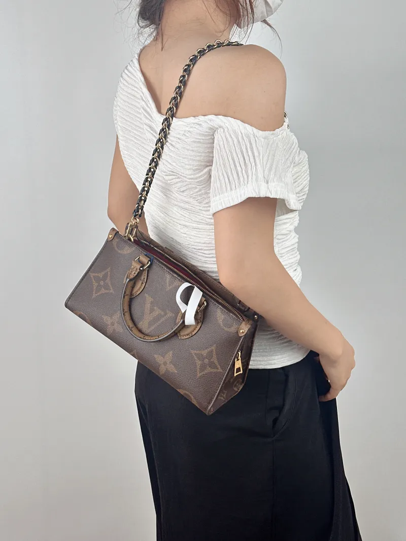 Louis Vuitton Crossbody Bag Onthego East West Two Straps Monogram PVC Small 25 × 10 × 13 cm — on-model view 1 of 2
