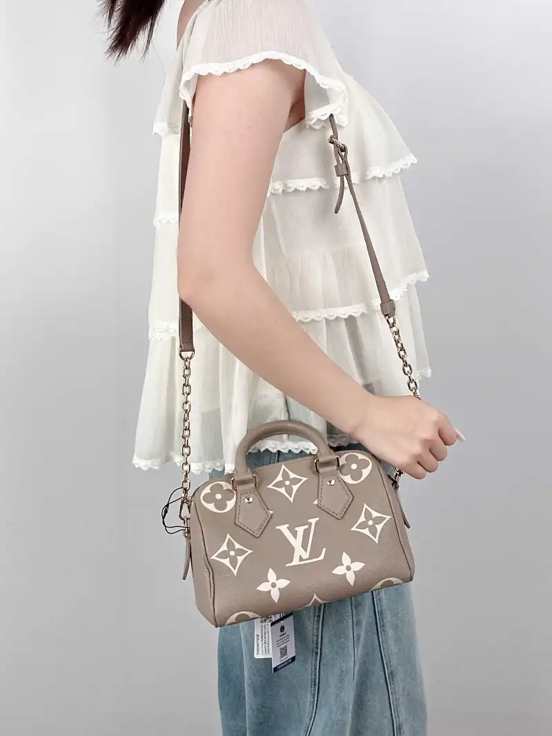 Louis Vuitton Crossbody Bag Speedy20 · White Monogram Empreinte Embossed Calfskin Small 20.5 × 12 × 13.5 cm — on-model view 1 of 3
