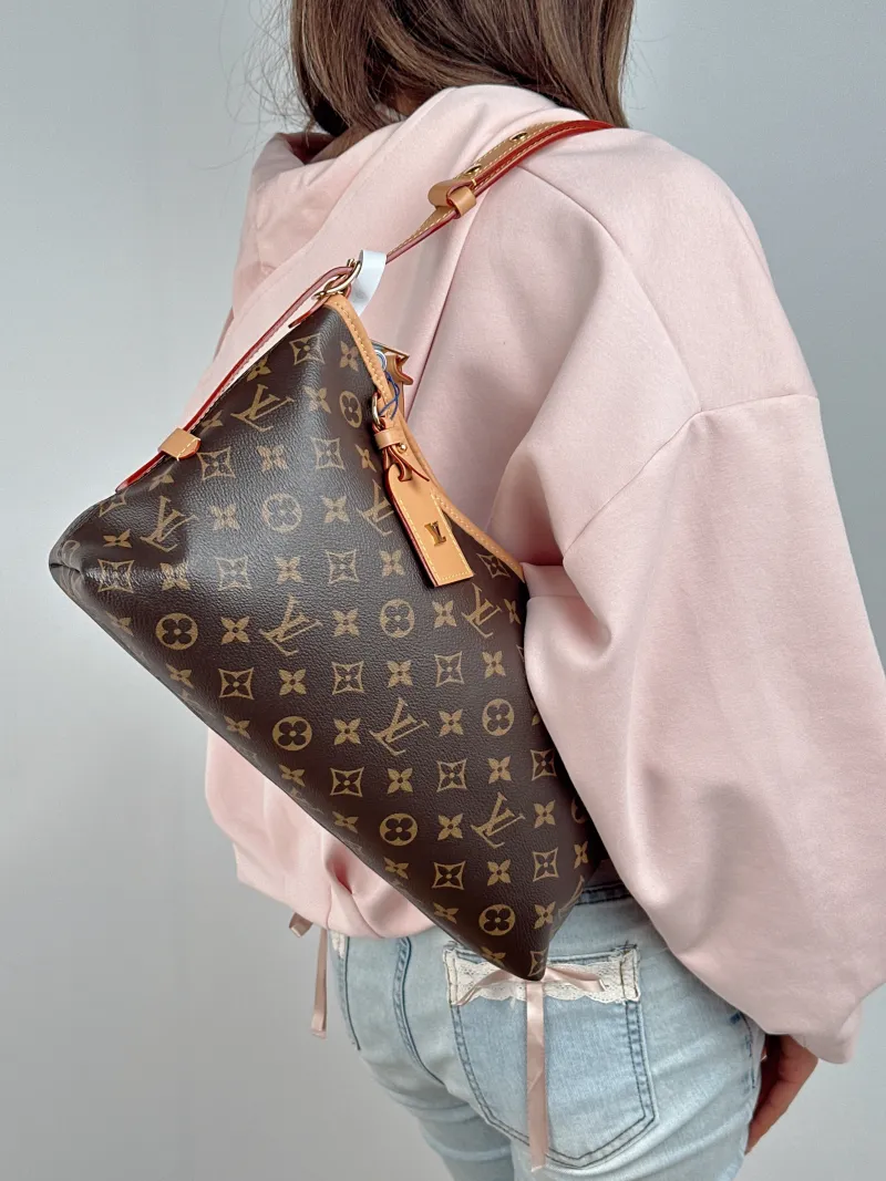Louis Vuitton Shoulder Bag Carryall East West Monogram PVC One Size 36 × 10 × 19 cm — on-model view 1 of 3