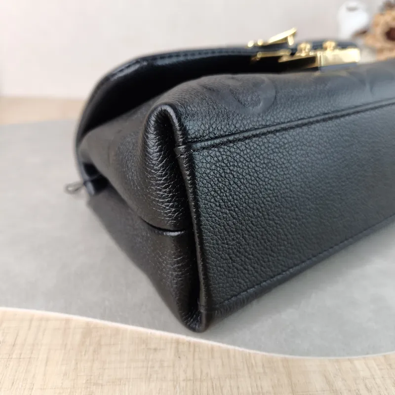 Louis Vuitton Crossbody Bag MADELEINE Black Empreinte Embossed Calfskin BB 24 × 8.5 × 17 cm — detail view 9 of 12