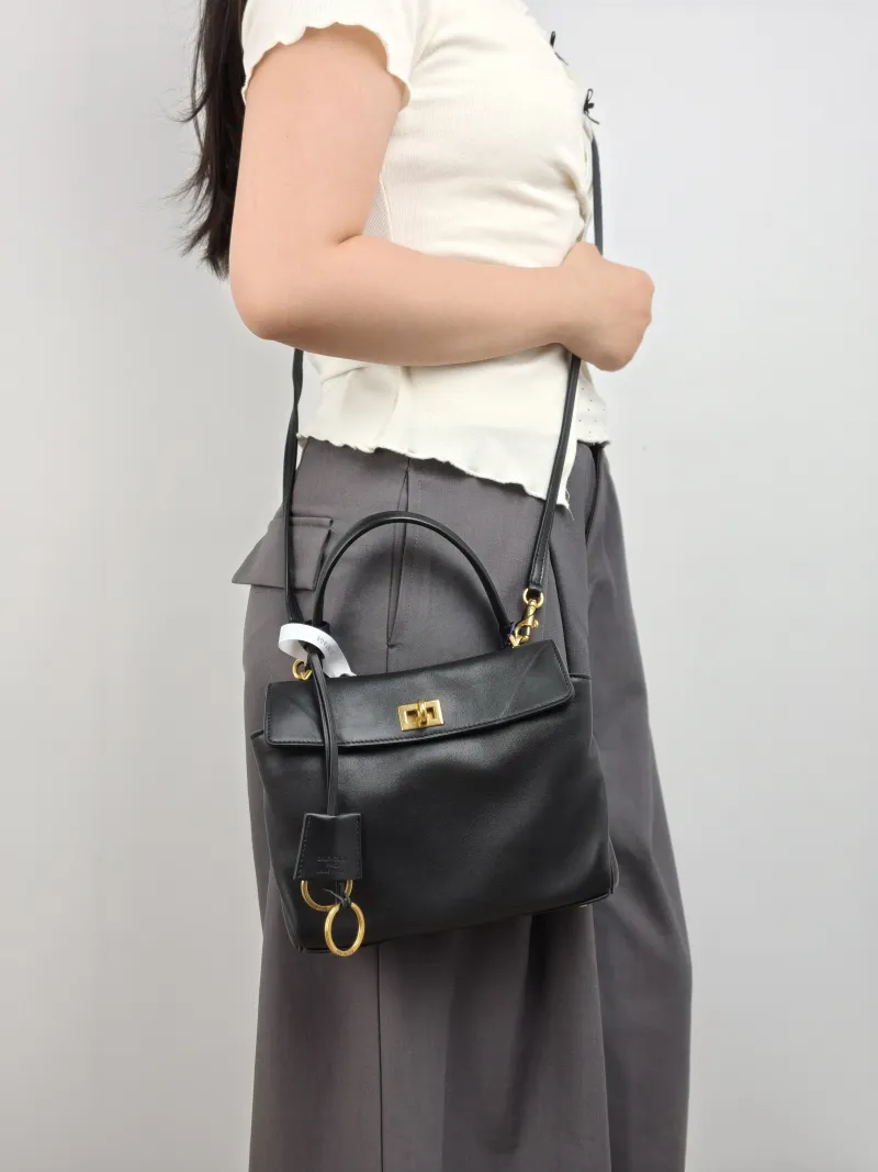 BALENCIAGA Crossbody Bag RODEO Black CC alfskin Mini 23 × 10 × 17 cm — on-model view 2 of 3