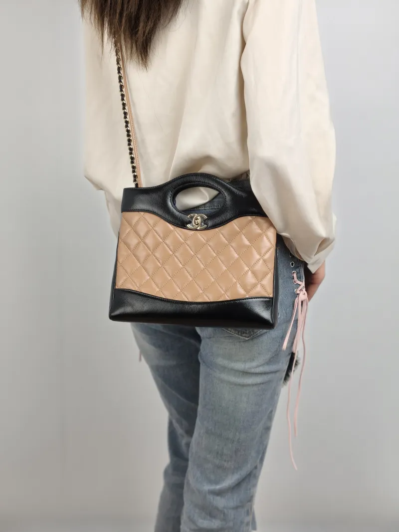 Chanel Crossbody Bag 31Bag Beige Black Lambskin Mini 23 × 5.5 × 22 cm — on-model view 2 of 2