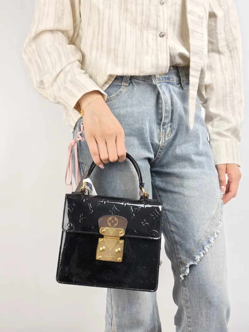 Louis Vuitton Crossbody Bag Spring Street Black Patent Leather · PVC One Size 17 × 8.5 × 16 cm Leather Tag — on-model view 1 of 2
