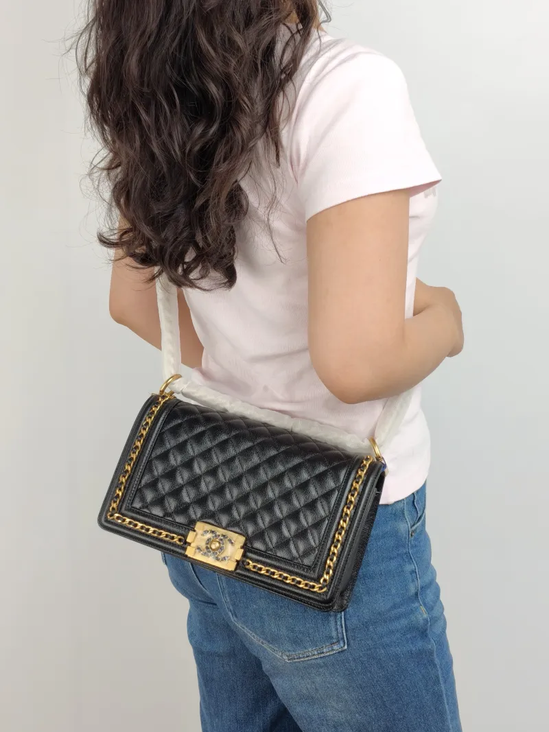 Chanel Crossbody Bag Le Boy​ Black Grained Calfskin Medium 25 × 9 × 15 cm — on-model view 1 of 2