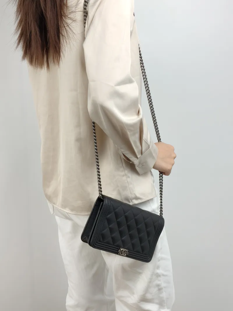 Chanel Crossbody Bag Le Boy​ WOC Black Grained Calfskin Mini 19.2 × 3.5 × 12.3 cm — on-model view 1 of 2