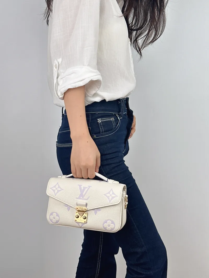 Louis Vuitton Crossbody Bag Pochette Métis East West White · Empreinte Embossed Calfskin Small 21.5 × 6 × 13.5 cm — on-model view 2 of 3