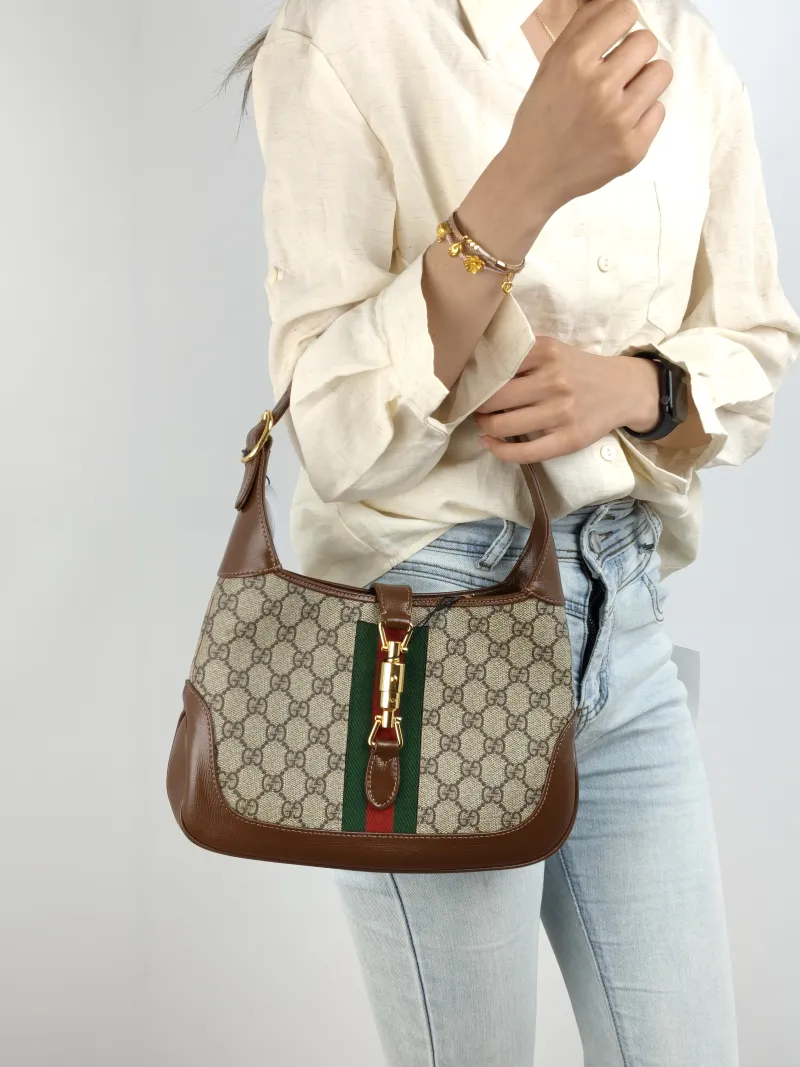 GUCCI Shoulder Bag Jackie 1961Collection Monogram PVC Medium 27.5 × 4 × 19 cm — on-model view 2 of 3