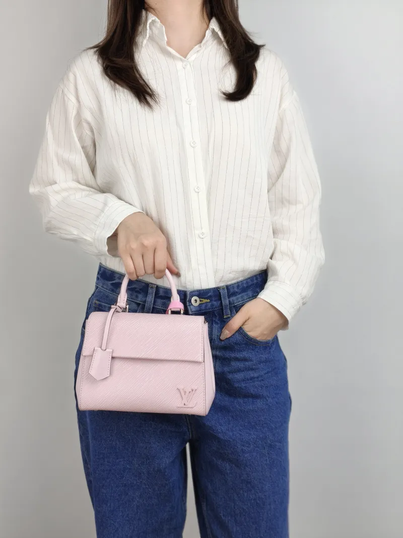 Louis Vuitton Crossbody Bag CLUNY Pink Epi Embossed Calfskin Mini 20 × 7.5 × 16 cm — on-model view 1 of 3