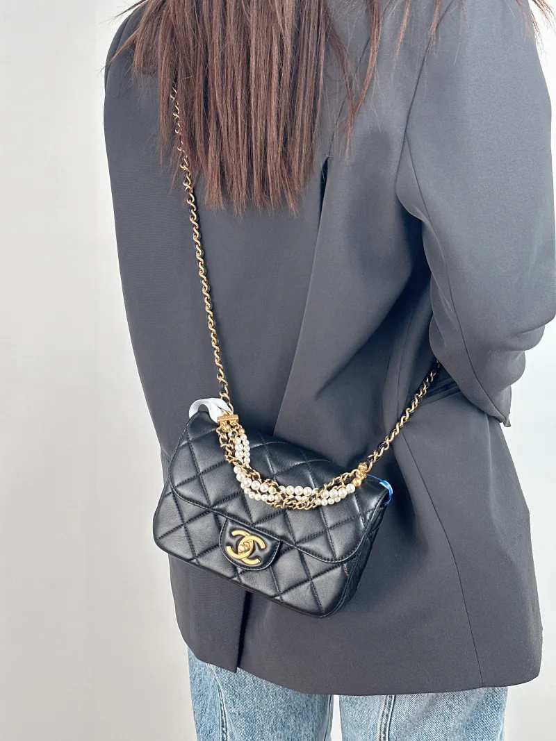 Chanel Crossbody Bag Pearl Black Calfskin Small 19 × 6 × 13 cm — on-model view 2 of 3