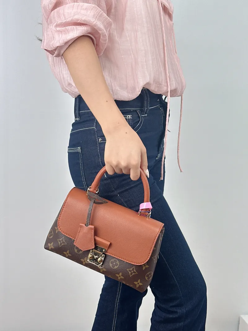 Louis Vuitton Crossbody Bag MADELEINE PVC · Calfskin BB 24.5 × 8 × 16 cm — on-model view 2 of 2