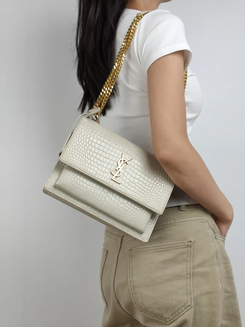 SAINT LAURENT Crossbody Bag SUNSET White Calfskin Medium 22 × 6.5 × 16 cm — on-model view 1 of 2