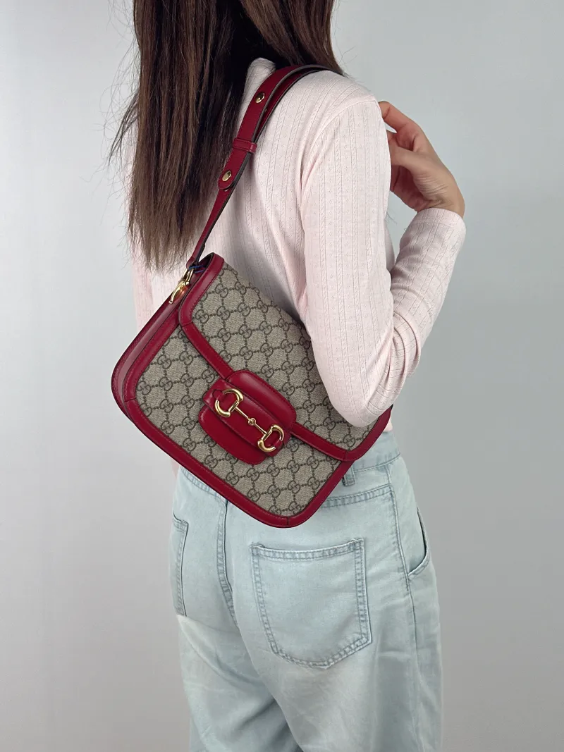 GUCCI Crossbody Bag Horsebit 1955 Horsebit Medium Red PVC Medium 25 × 8 × 18 cm — on-model view 1 of 2