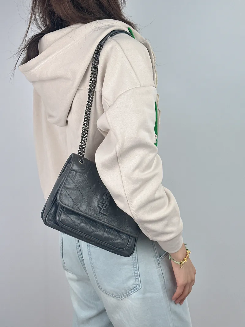 SAINT LAURENT Crossbody Bag Niki D Dark Grey Waxed Leather Calfskin Small 21 × 7.5 × 16 cm — on-model view 1 of 2