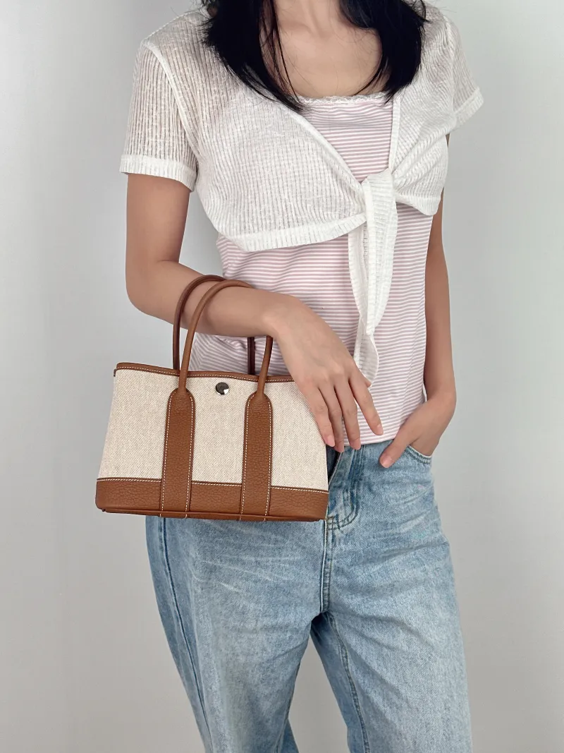 Hermès Top Handle Bag Neo Garden 23 Mini Canvas mini23 × 10 × 16 cm — on-model view 1 of 2