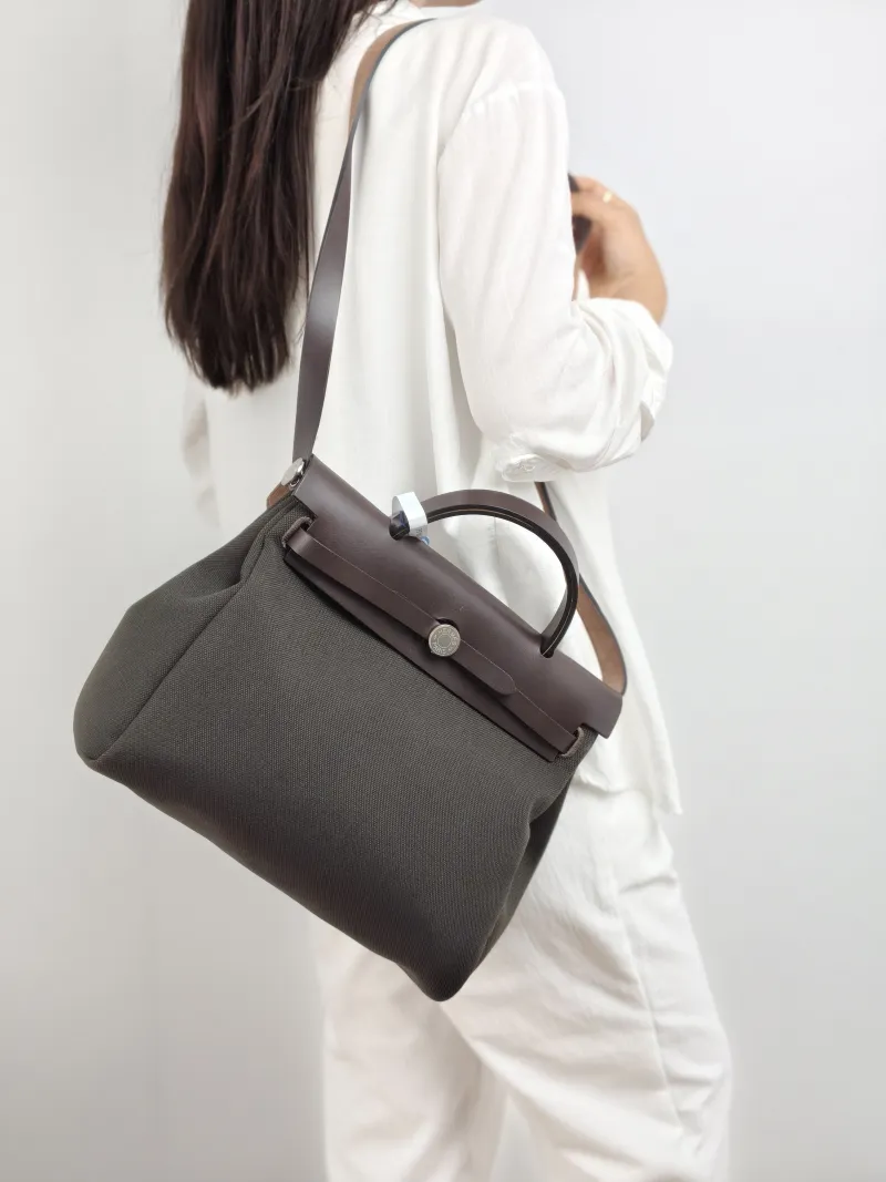 Hermès Crossbody Bag Herbag 31 Colorblock Canvas · Calfskin Medium 30.5 × 11 × 25.5 cm w — on-model view 1 of 2