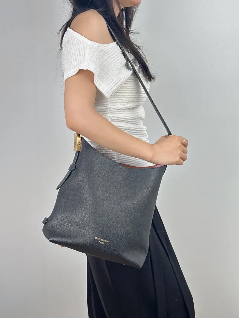 Louis Vuitton Shoulder Bag Low Key Hobo Shoulder Bag Black Calfskin Small 24 × 16 × 28 cm — on-model view 2 of 2