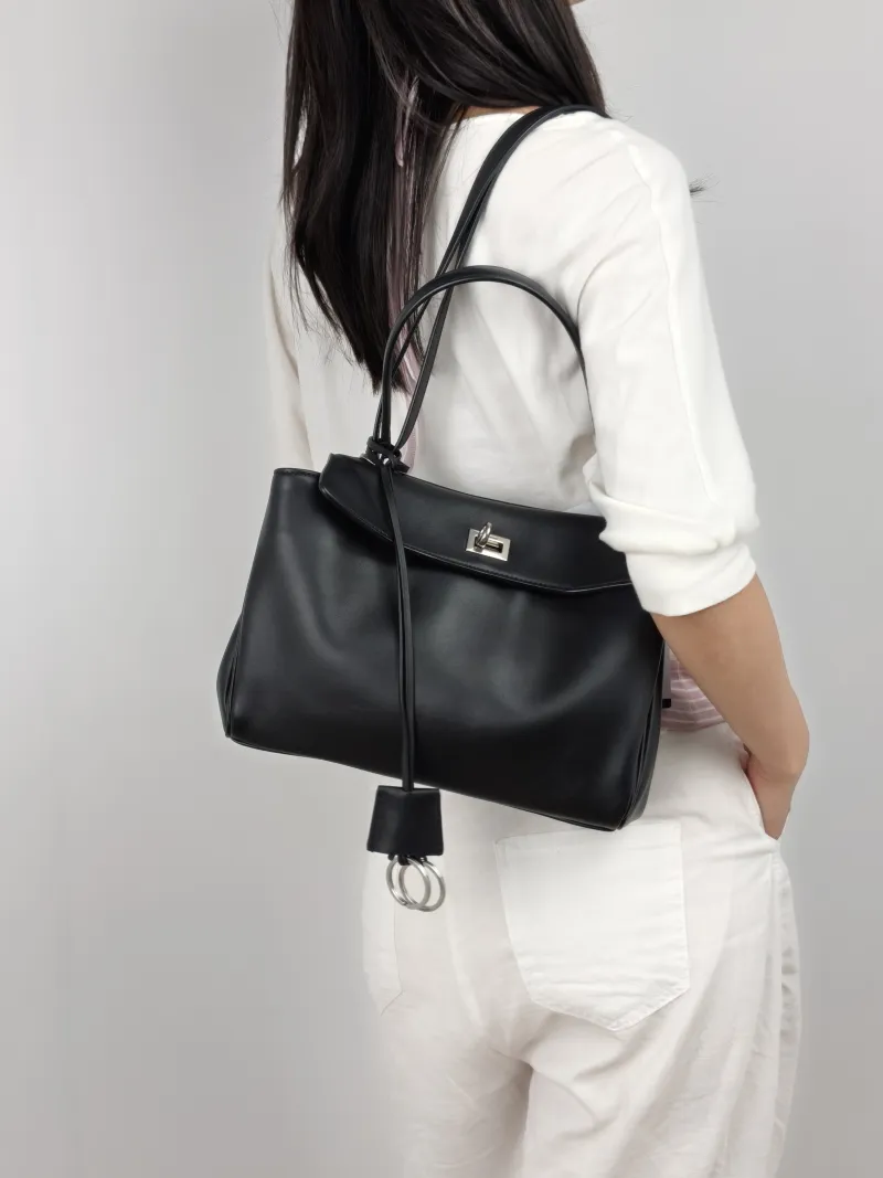 BALENCIAGA Crossbody Bag RODEO Black Calfskin Small 27 × 10 × 20 cm — on-model view 1 of 3