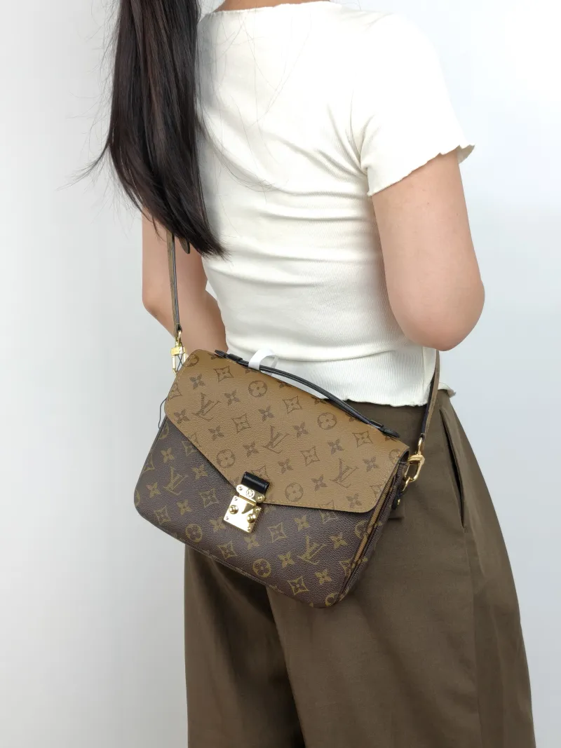Louis Vuitton Crossbody Bag Pochette Métis Monogram Colorblock PVC Medium 25 × 7 × 19 cm — on-model view 2 of 3