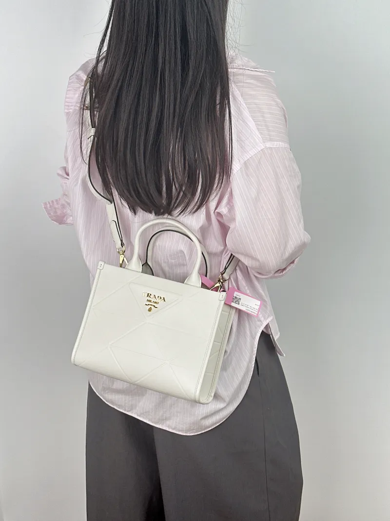 PRADA Top Handle Bag Tote Bag White Calfskin Small 24 × 10 × 18.5 cm — on-model view 1 of 2