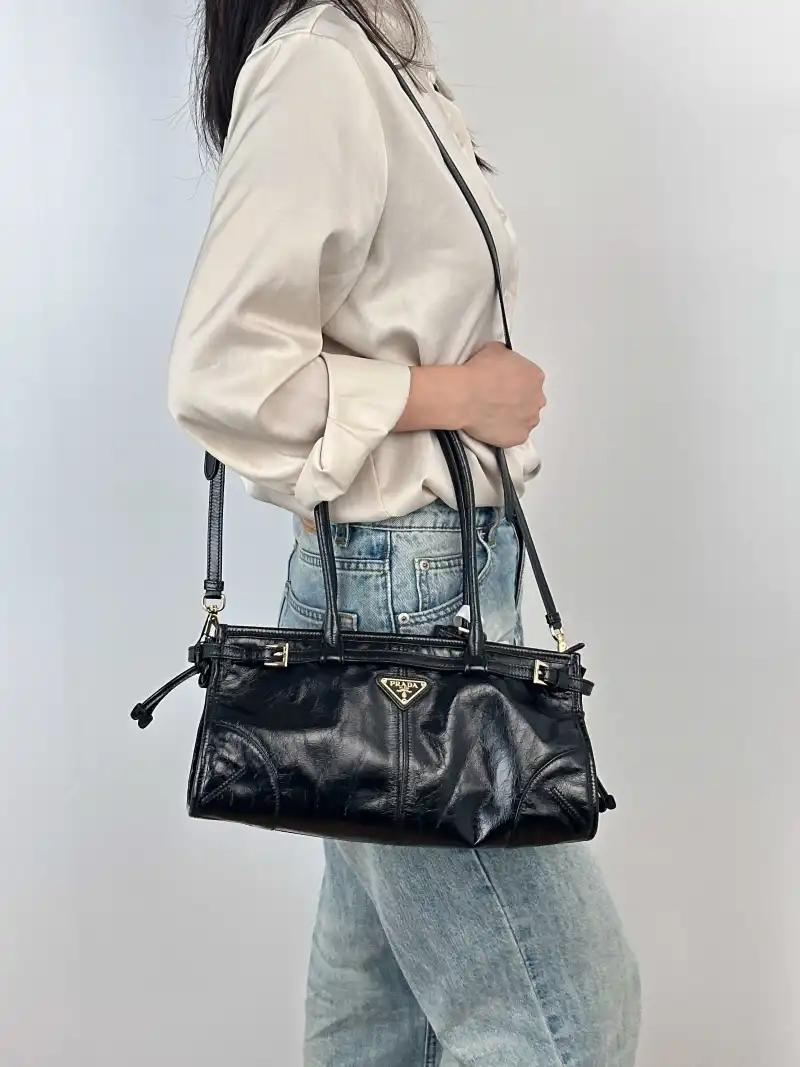 PRADA Shoulder Bag Bonnie Soft Lux Black Waxed Leather Medium32 × 12 × 15.5 cm — on-model view 4 of 5