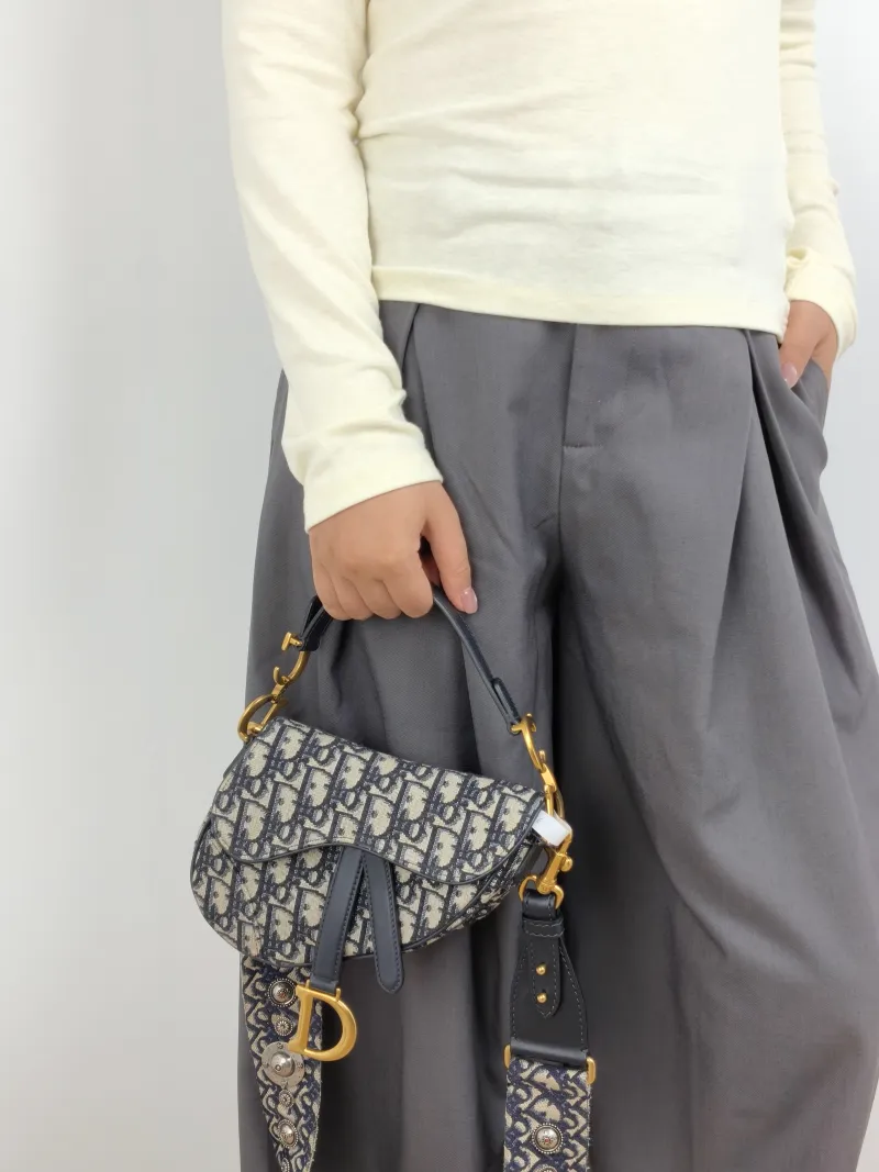 DIOR Top Handle Bag Saddle Blue Canvas Mini 19 × 6 × 15 cm — on-model view 1 of 2