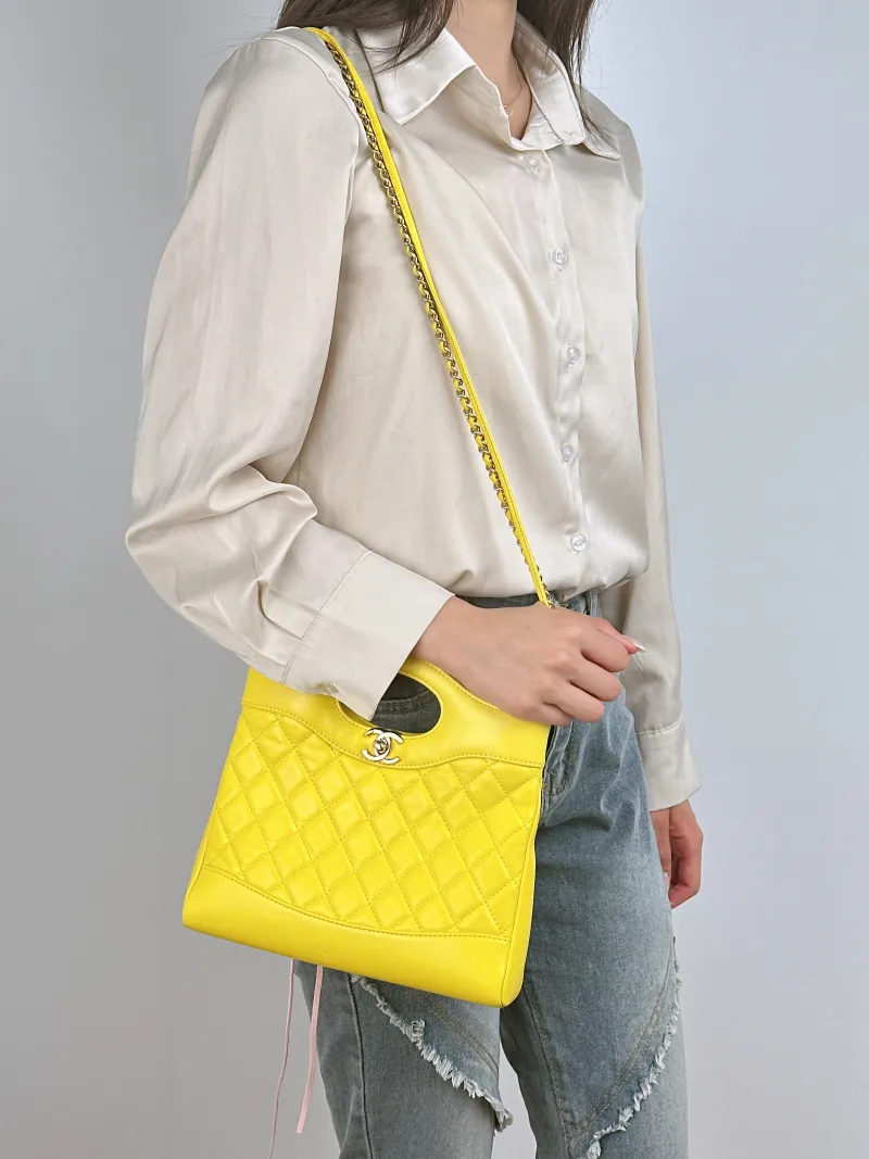Chanel Crossbody Bag 31Bag Yellow Waxed Leather Mini 23 × 5.5 × 22 cm — on-model view 3 of 3