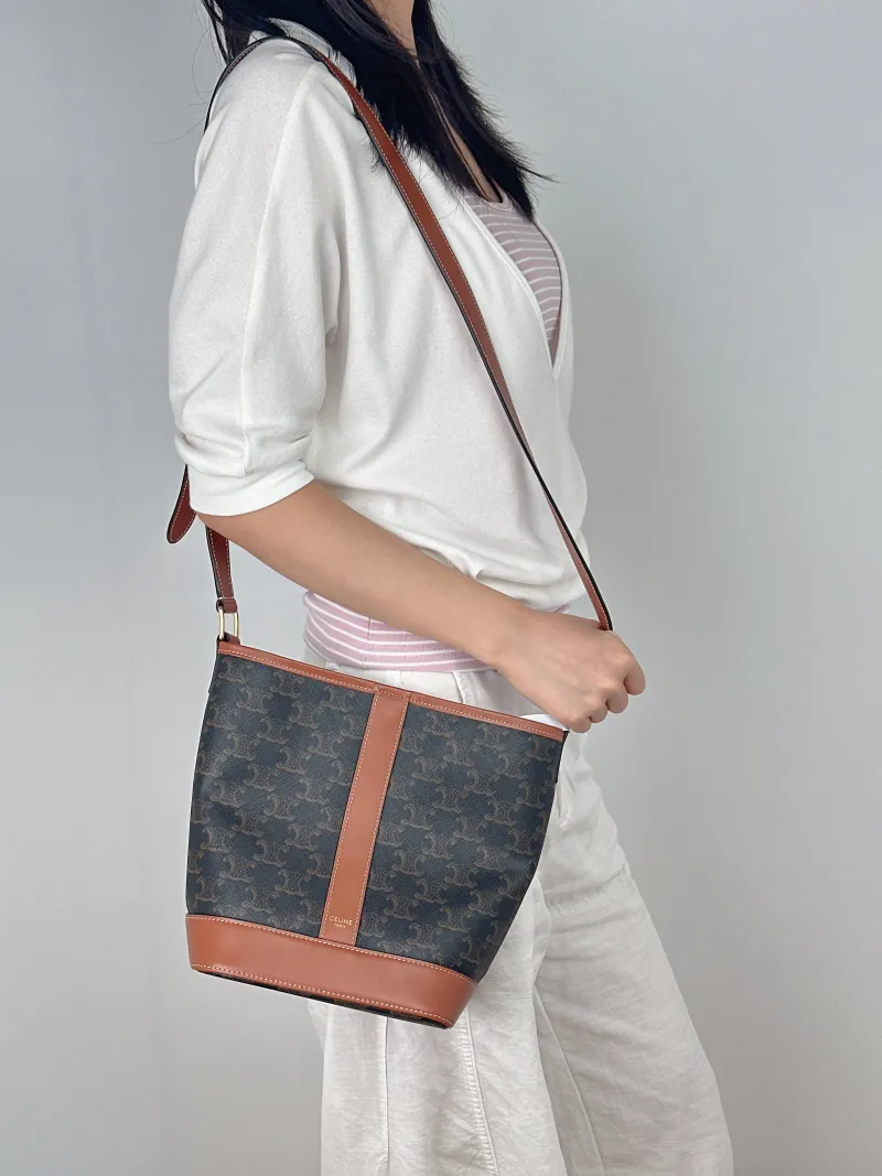 CELINE Crossbody Bag Triomphe Bucket Bag Monogram PVC Small22 × 13 × 26 cm — on-model view 1 of 2