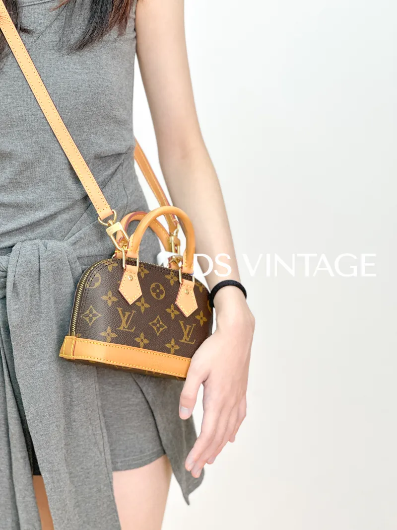 Louis Vuitton Crossbody Bag Alma Nano Monogram PVC nano 18 × 8 × 12 cm — on-model view 2 of 3