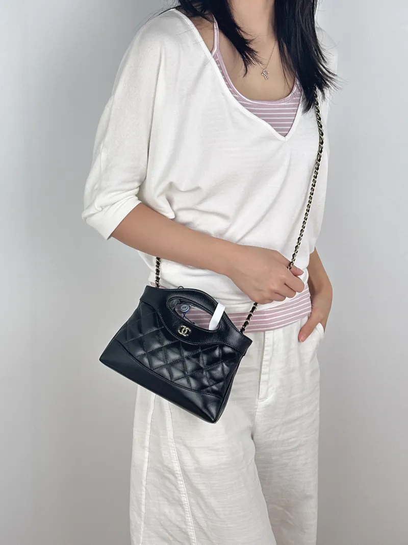 Chanel Crossbody Bag31Bag Black Waxed Leathernano20.5 × 3.5 × 17 cm — on-model view 1 of 3
