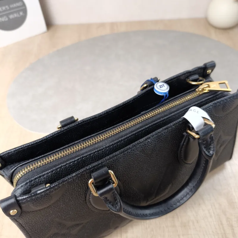 Louis Vuitton Crossbody Bag Onthego East West Two Straps Black Monogram Empreinte Embossed Calfskin Small 25 × 10 × 13 cm — detail view 1 of 11