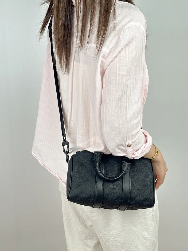 Louis Vuitton Crossbody Bag Keepall 25 Taurillon Embossed Calfskin Monogram Medium25 × 11 × 15 cm — on-model view 1 of 2