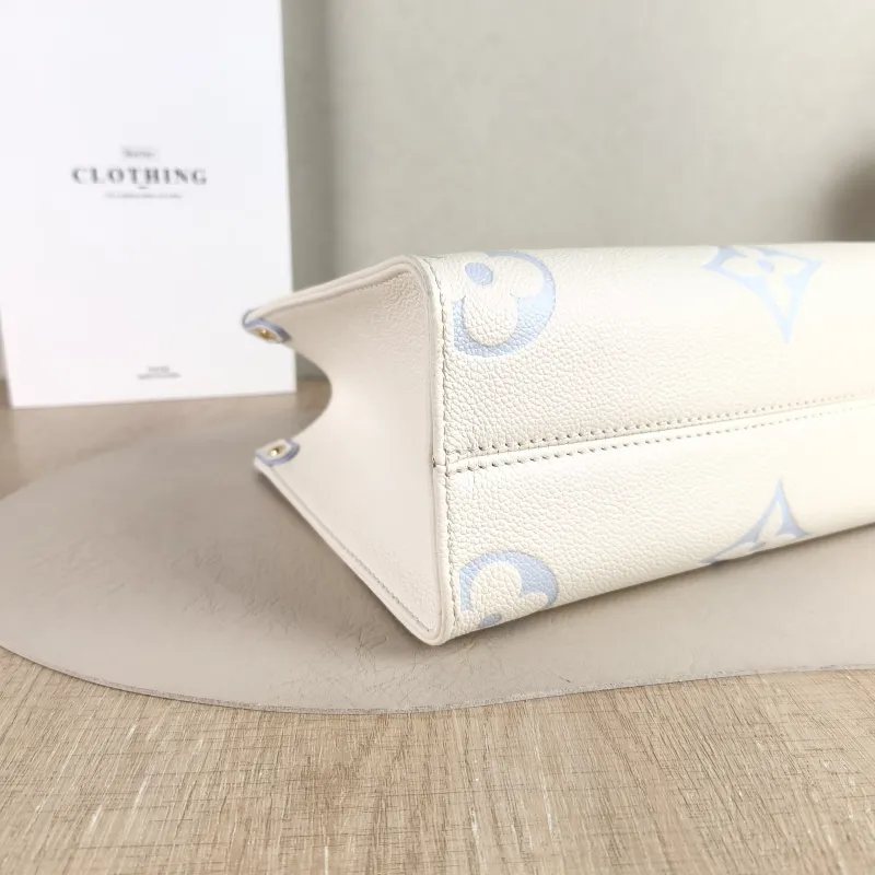 Louis Vuitton Shoulder Bag Onthego White · Blue Monogram Empreinte Embossed Calfskin Small 25 × 11.5 × 19 cm — detail view 7 of 11