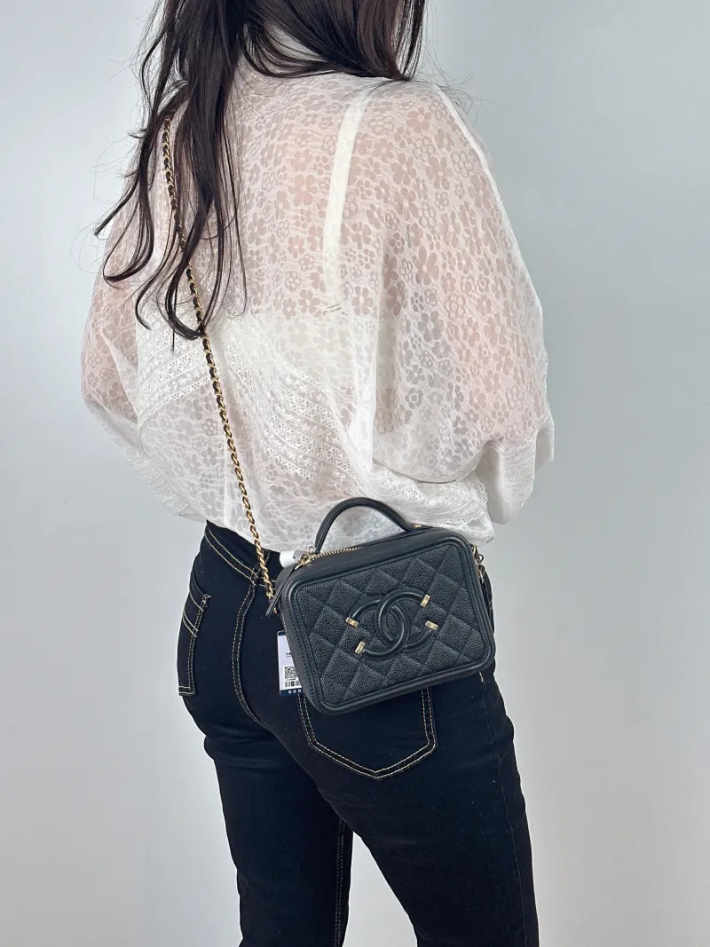 Chanel Crossbody Bag CC Filigree Vanity Cosmetic Bag Black Grained Calfskin Small 16 × 7 × 12 cm 26 — on-model view 1 of 2