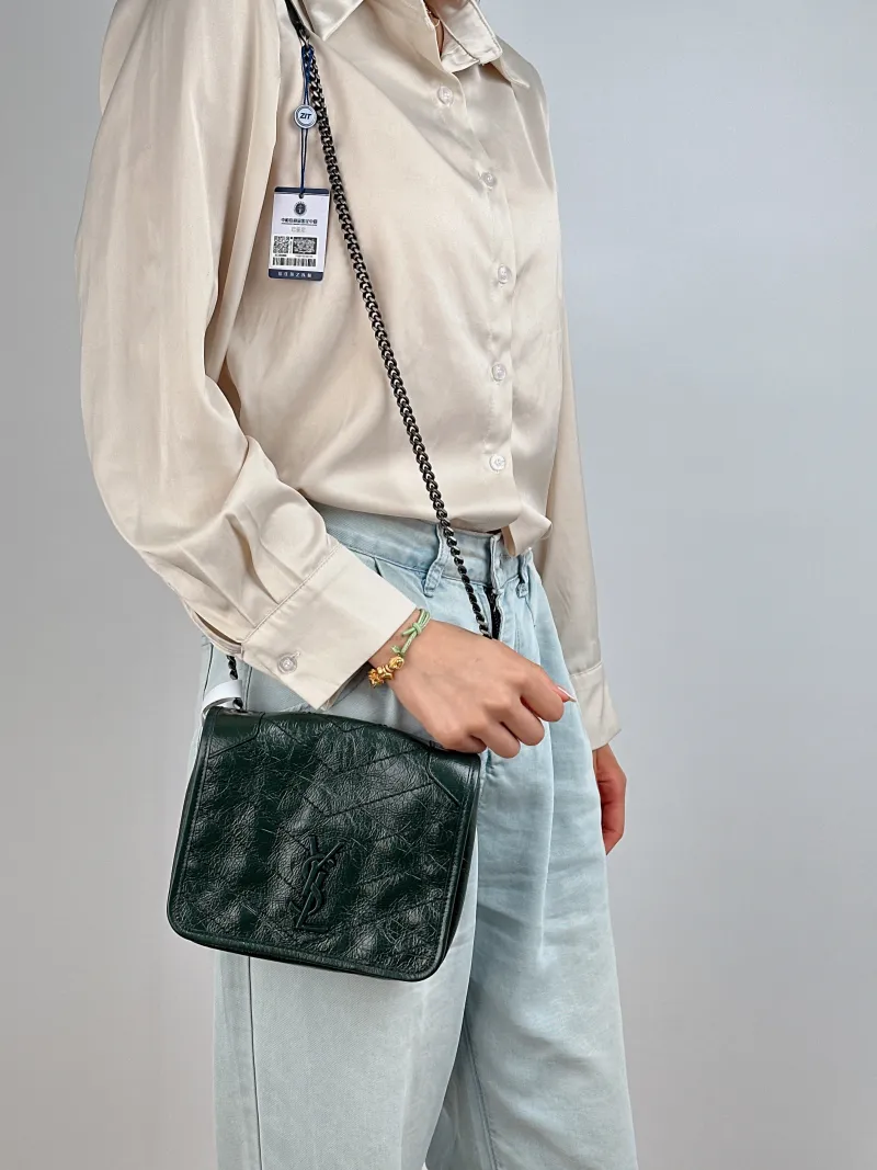 SAINT LAURENT Crossbody Bag Niki Chain Bagwoc Green Calfskin Mini 19 × 5 × 16 cm — on-model view 2 of 2