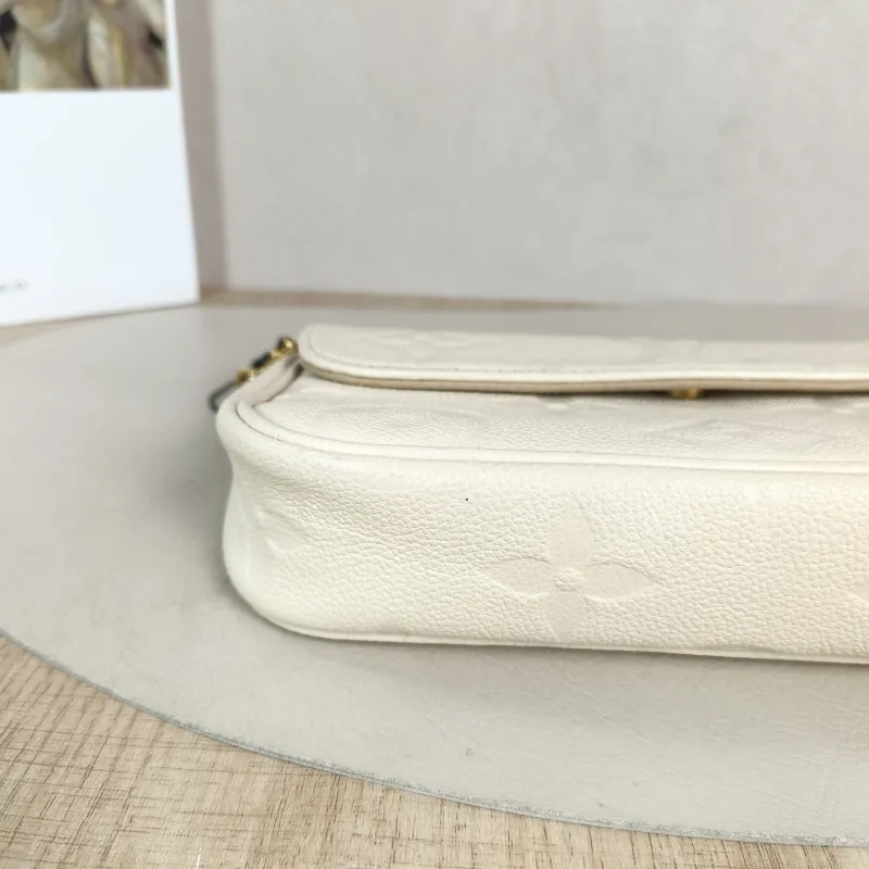 Louis Vuitton Crossbody Bag IVY White Monogram Empreinte Embossed Calfskin Small 23.5 × 4.3 × 12 cm — detail view 4 of 11