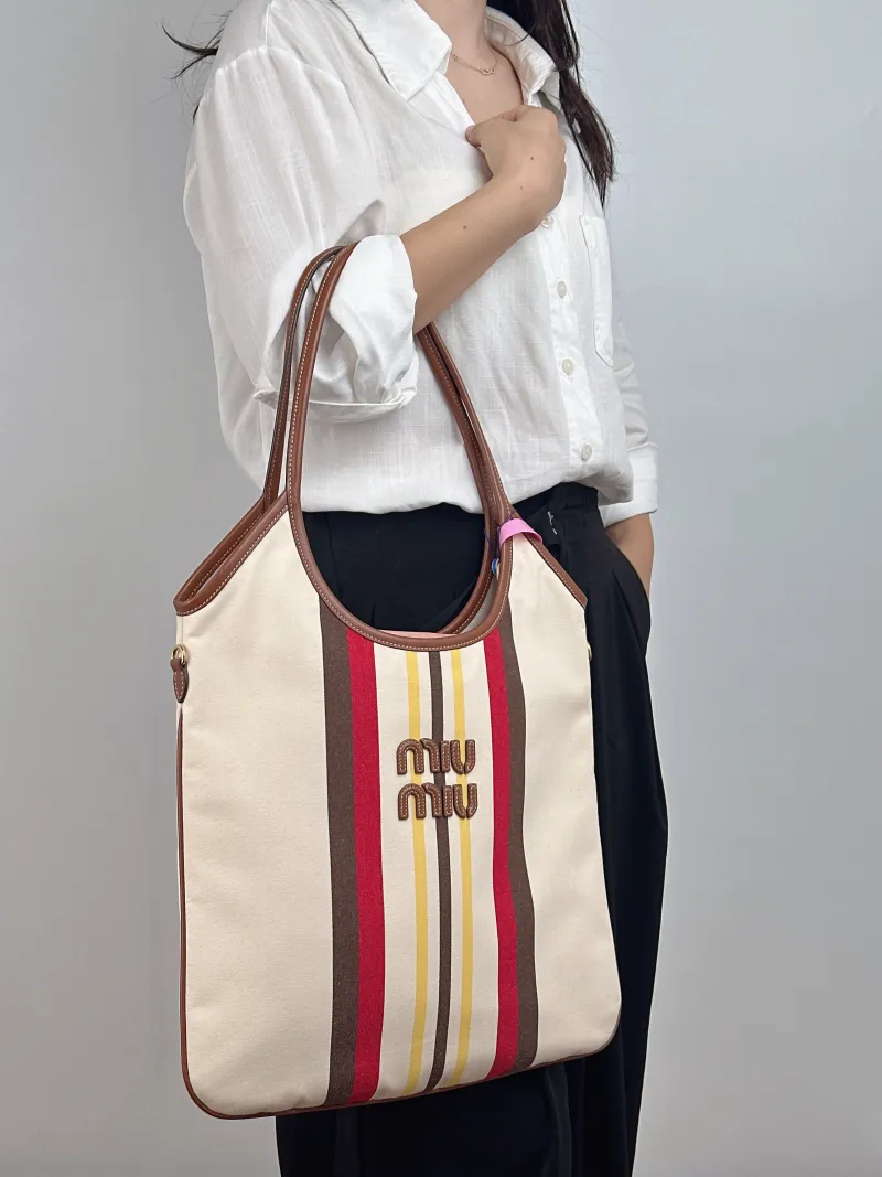 Miumiu Shoulder Bag IVY Tote Shopping Tote Canvas Medium 35*40 — on-model view 1 of 2