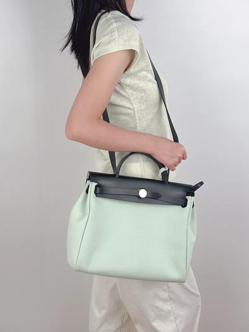 Hermès Shoulder Bag Herbag 31 Green Canvas Medium31 × 10 × 25 cm — on-model view 2 of 3