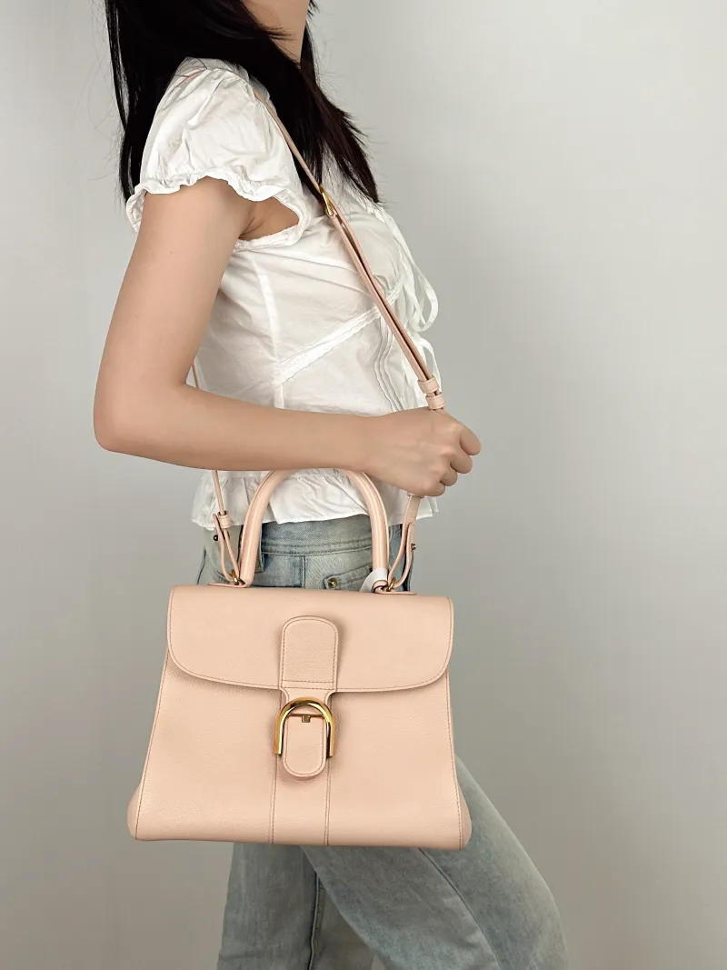 DELVAUX Top Handle Bag Brillant Pink Calfskin Medium29 × 15 × 22 cm — on-model view 1 of 3