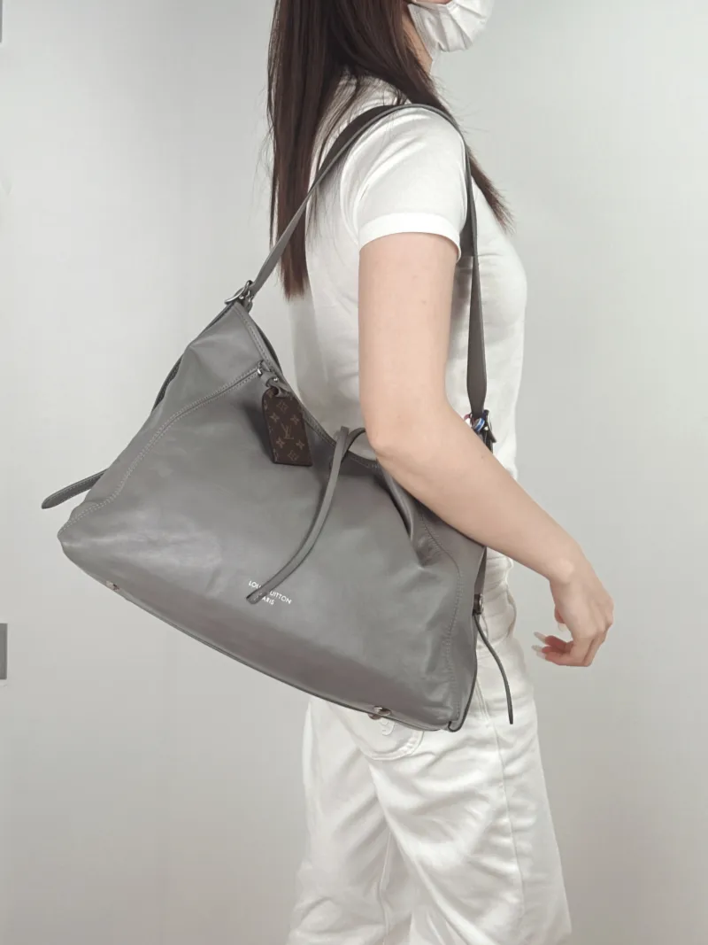 Louis Vuitton Crossbody Bag Carryall Vibe Grey SL ambskin Medium39 × 15 × 30 cm — on-model view 2 of 2