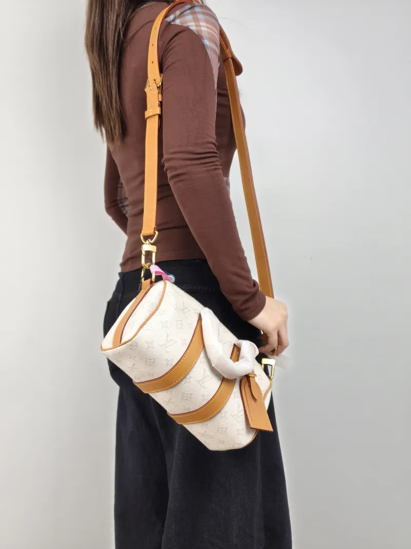 Louis Vuitton Crossbody Bag Keepall 25 White Monogram PVC Medium 25 × 11 × 15 cm — on-model view 1 of 3