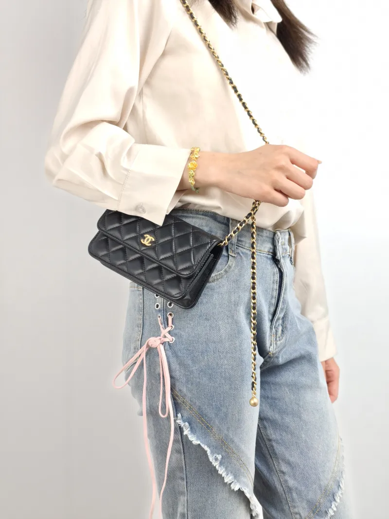 Chanel Crossbody Bag woc Black with Gold-Tone Hardware Lambskin Mini 17 × 5 × 9.5 cm — on-model view 2 of 2