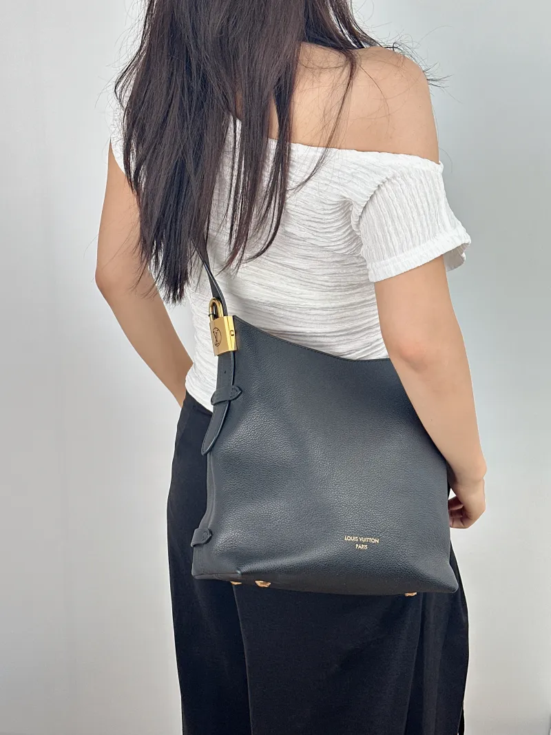 Louis Vuitton Shoulder Bag Low Key Hobo Shoulder Bag Black Calfskin Small 24 × 16 × 28 cm — on-model view 1 of 2